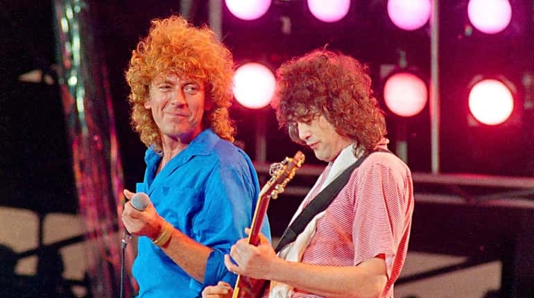 Robert Plant, left, and Jimmy Page of Led Zeppelin perform...