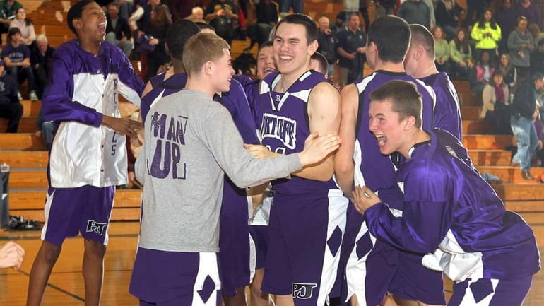 Port Jefferson players celebrates their victory over Greenport in the...