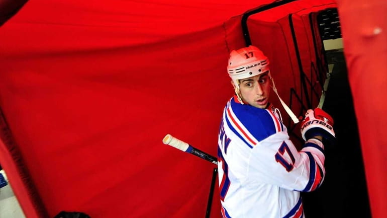 Rangers' Brandon Dubinsky leaves the ice after warmups before a...