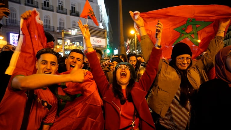 Morocco fans celebrate in the central Puerta del Sol in...