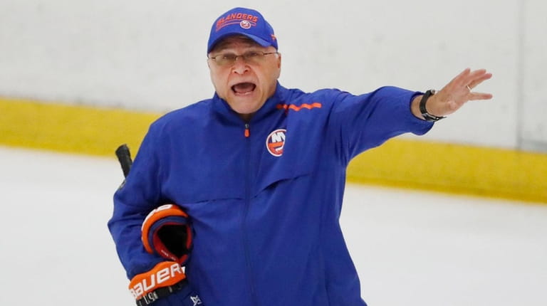 Islanders head coach Barry Trotz give instructions during practice at...