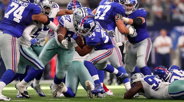 Shane Vereen of the New York Giants carries the ball...
