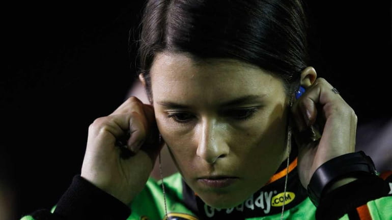 Danica Patrick, driver of the #10 GoDaddy.com Chevrolet, stands on...