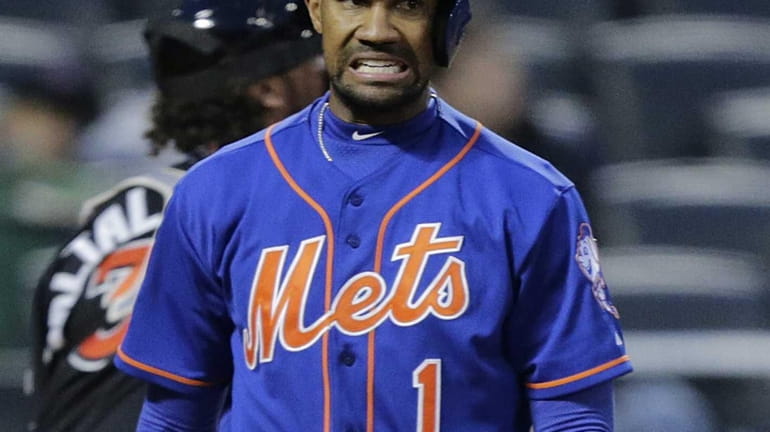 Mets leftfielder Chris Young reacts after striking out in the...