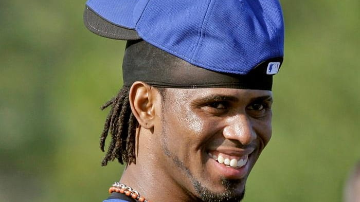 Jose Reyes smiles during a workout on his first day...