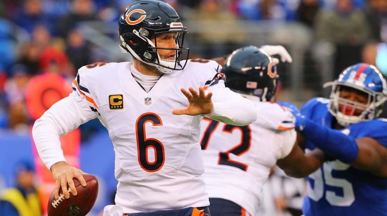 Jay Cutler of the Chicago Bears looks to pass against...