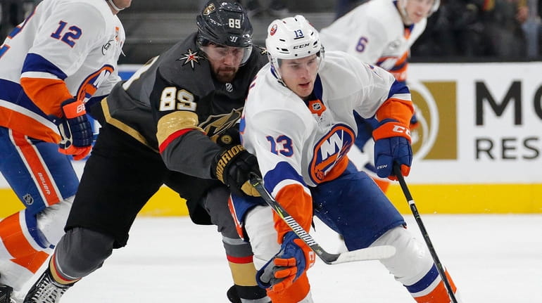 New York Islanders center Mathew Barzal (13) skates around Vegas...