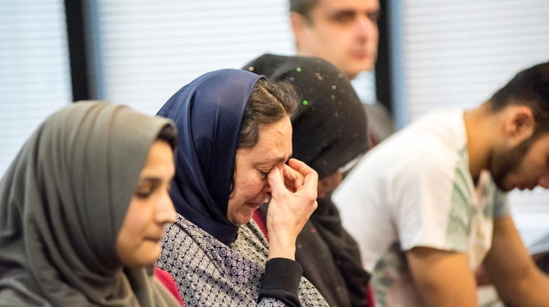 Sanaa Nadim, Stony Brook University's Muslim chaplain, becomes emotional during...