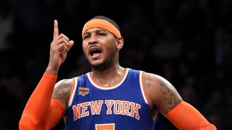 Carmelo Anthony reacts during the second half of an NBA...