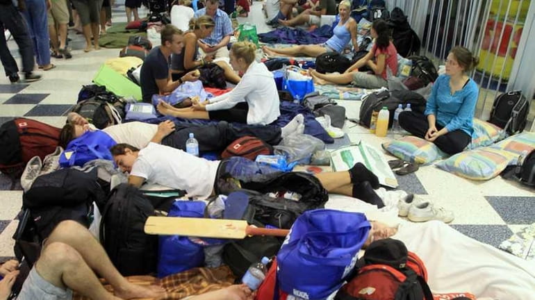 People pack a shopping mall used as a evacuation shelter...