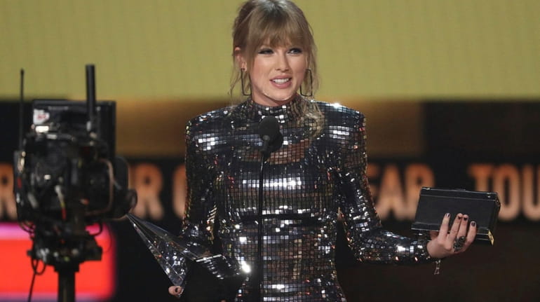Taylor Swift accepts the award for tour of the year...
