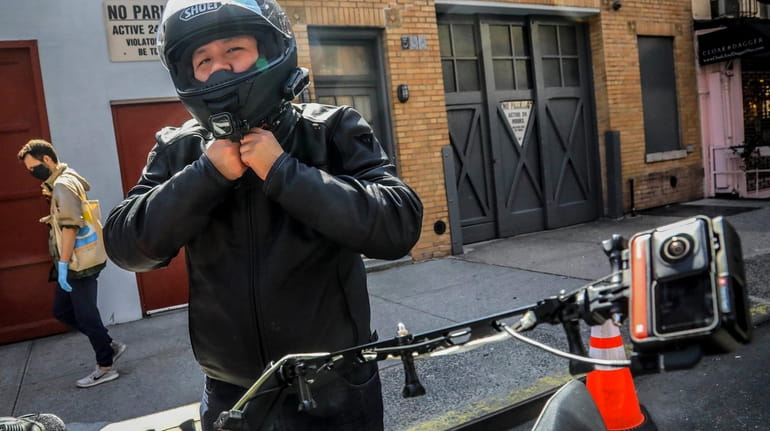 Eddie Song, a Korean American entrepreneur, prepares to ride his...