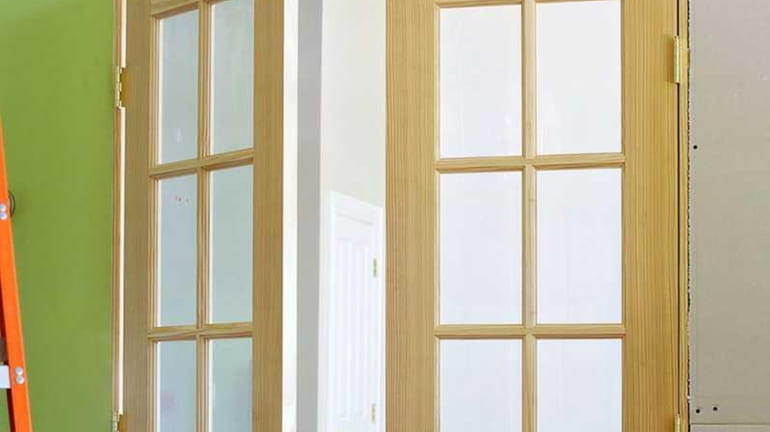These interior French doors just need trim, paint and hardware...
