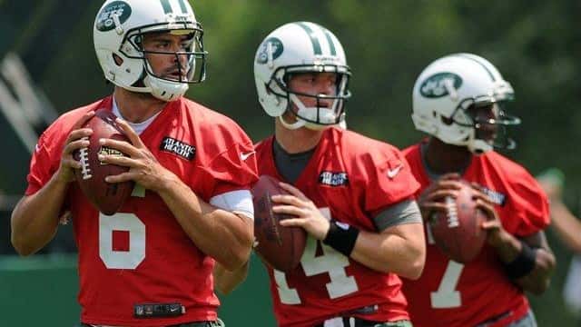 Left to right: Mark Sanchez, Greg McElroy, center, and Geno...