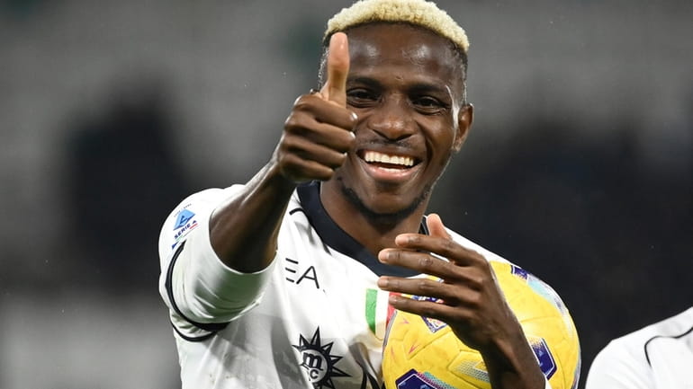Napoli's Victor Osimhen gives the thumb up sign after he...