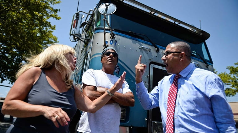 Assemblyman Phil Ramos argues with Laura from Diamond Trucking in...