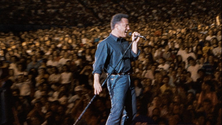 Billy Joel performing at Yankee Stadium in 1990.