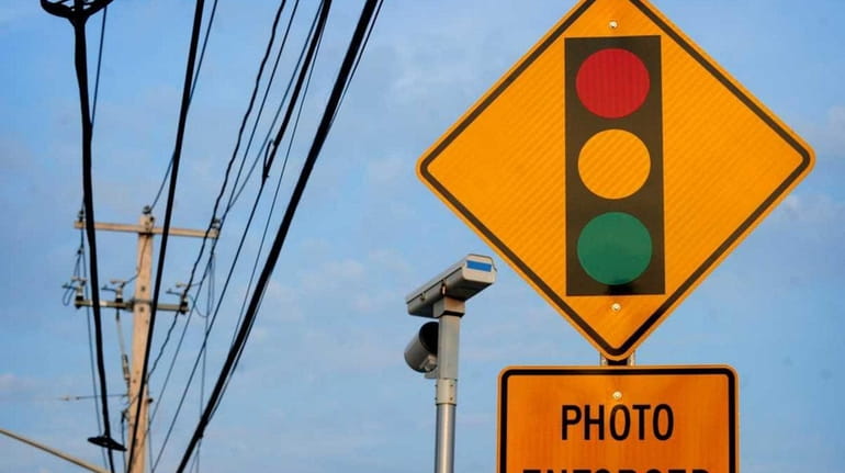 A red light camera on Middle Country Road near the...