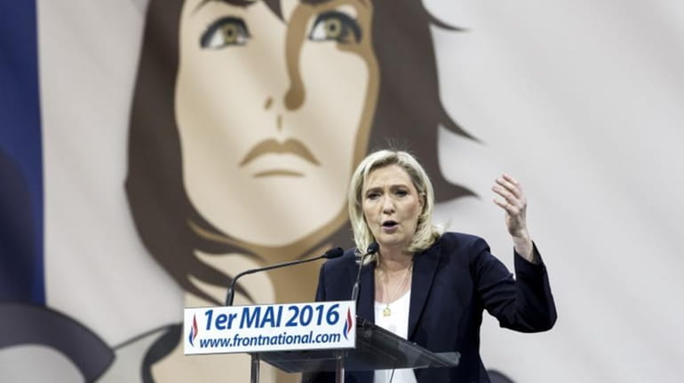 France's far-right National Front party leader Marine Le Pen addresses...