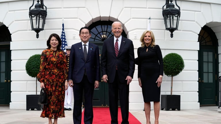President Joe Biden and first lady Jill Biden greet Japanese...