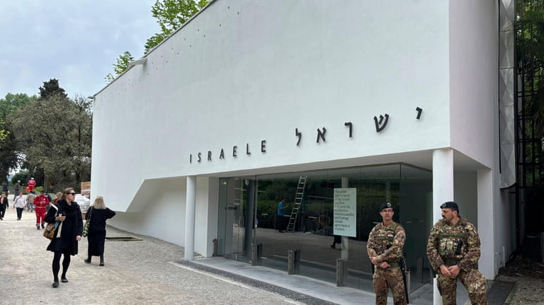 Italian soldiers patrol the Israeli national pavilion at the Biennale...