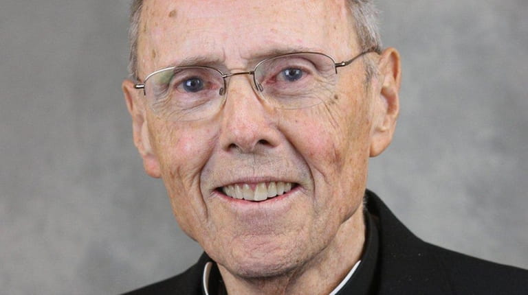 Msgr. Emmet P. Fagan turned to another priest at St....