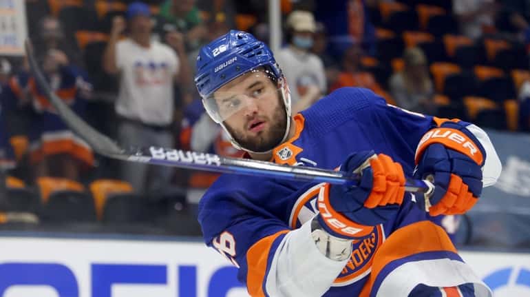 Oliver Wahlstrom of the New York Islanders warms up before...
