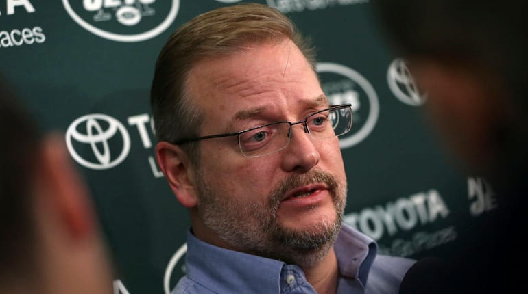 New York Jets general manager Mike Maccagnan answers a question...