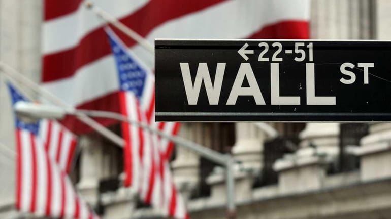 The Wall Street sign near the front of the New...