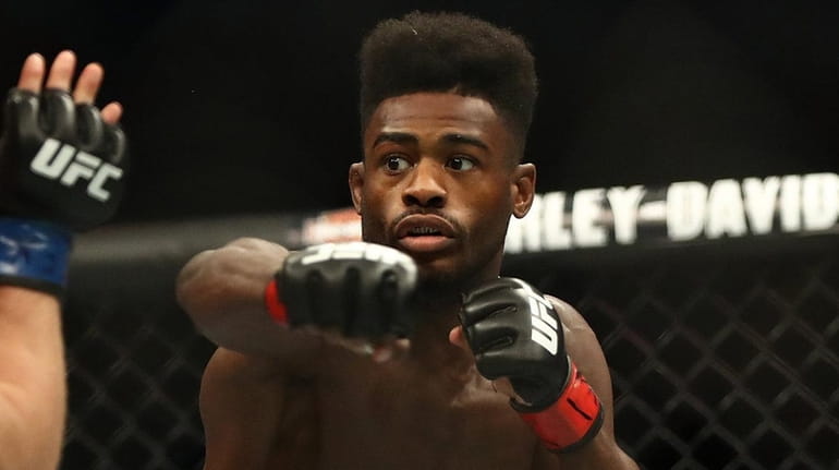 Aljamain Sterling punches Cody Stamann at UFC 228 at American...
