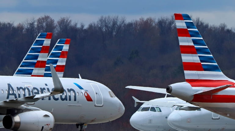 American Airlines planes are parked at Pittsburgh International Airport on...