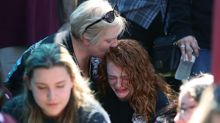 Tonja Kramer hugs her daughter Alyssa Kramer, 16, during a...