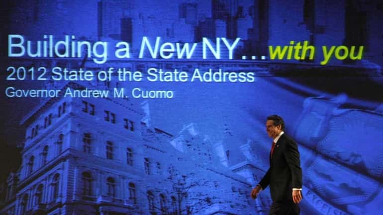 New York Gov. Andrew Cuomo walks to the podium to...