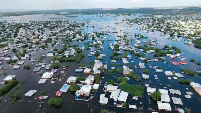 In this image made from video, flooded streets are seen...