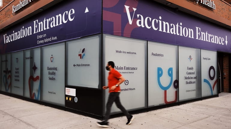 A health center advertises the COVID-19 vaccine in Brighton Beach, Brooklyn on Thursday.
