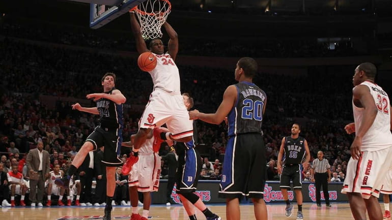 Justin Burrell #24 of the St. John's Red Storm dunks...