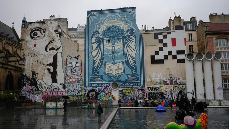 A mosaic by French artist Invader, top right, is seen...