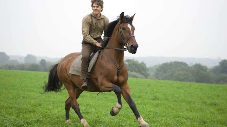 Albert Narracott (Jeremy Irvine) joyfully rides atop his beloved horse,...