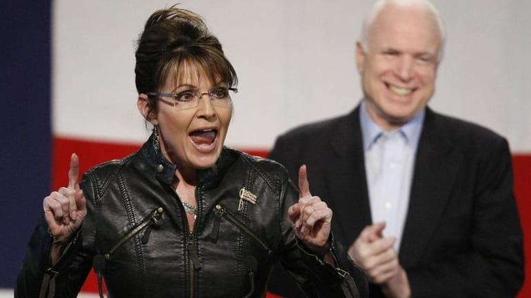 Sen. John McCain background right, and Sarah Palin, former Alaska...