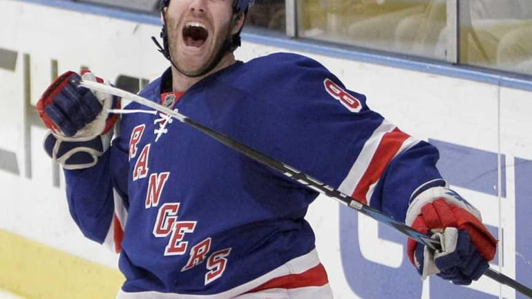 The Rangers' Brandon Prust reacts after scoring a goal against...