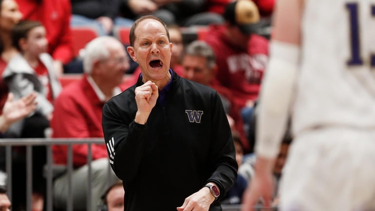 Washington head coach Mike Hopkins directs his team during the...