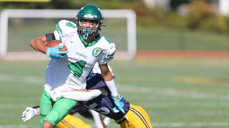 Farmingdale's Dillon Mehta (4) catches a pass and gets away...
