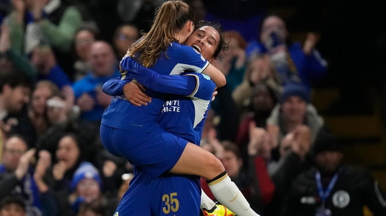Chelsea's Mayra Ramirez, right, celebrates after scores her side's first...