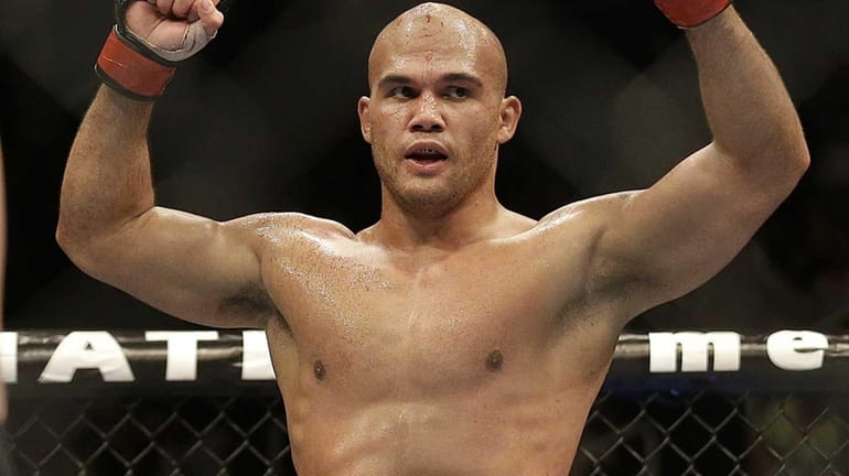 Robbie Lawler celebrates after the end of the fifth round...