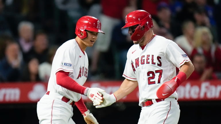 Los Angeles Angels' Shohei Ohtani, left, and Mike Trout celebrate...