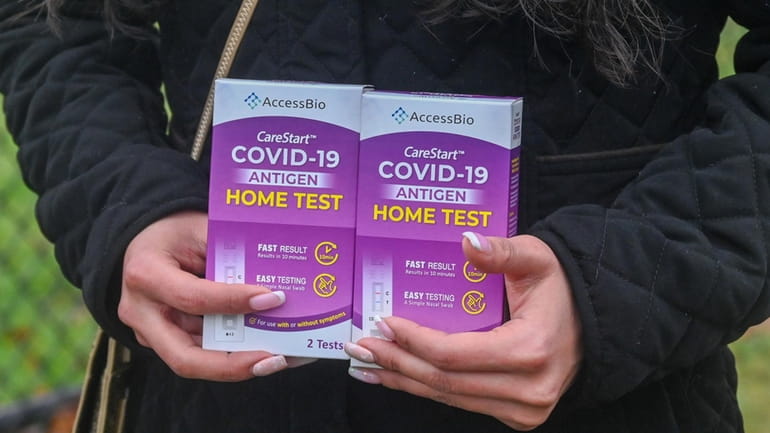 Home test kits shown at Huntington High School where COVID-19...