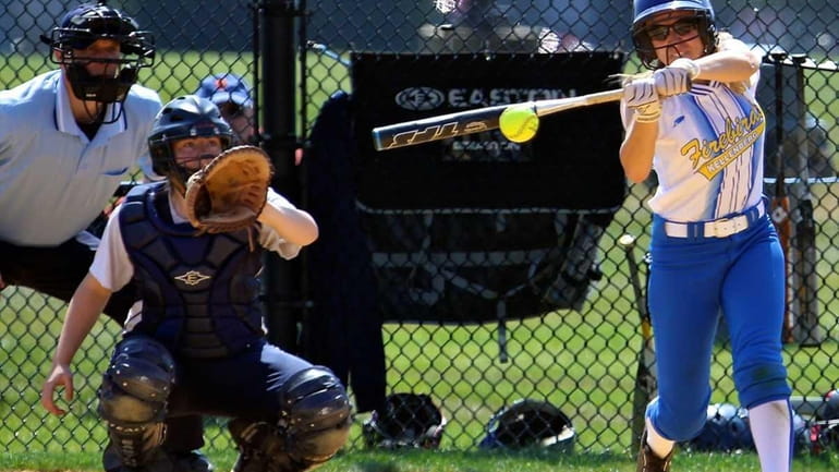 Kellenberg's Stephanie Staiano #12, drives the pitch through the infield...