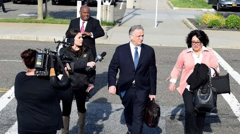 Edward and Linda Mangano arrive at federal court in Central...