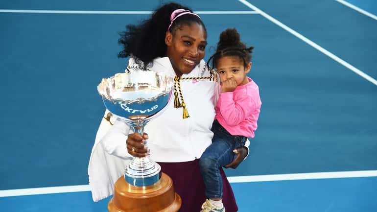 Serena Williams holds her daughter Alexis Olympia Ohanian Jr., and...