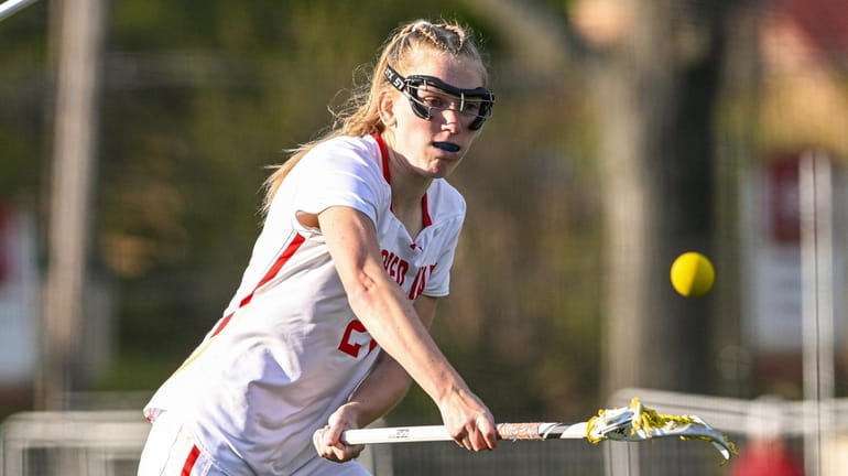 Charlotte Browne of Sacred Heart takes a shot on goal...